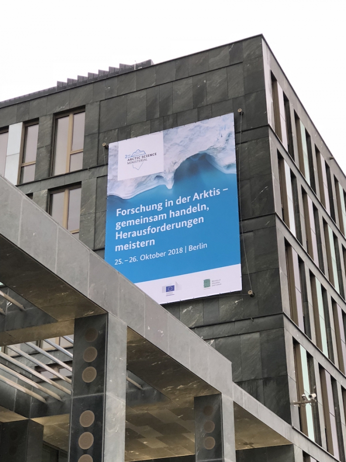 Figure 3. The venue for the ASM-2 Arctic Science Forum was the Federal Ministry of Education and Research on the north bank of the River Spree in Berlin. In English, the banner reads &quot;Cooperation in Arctic Science – Challenges and Joint Actions&quot;. Photo courtesy of Martin Jeffries.
